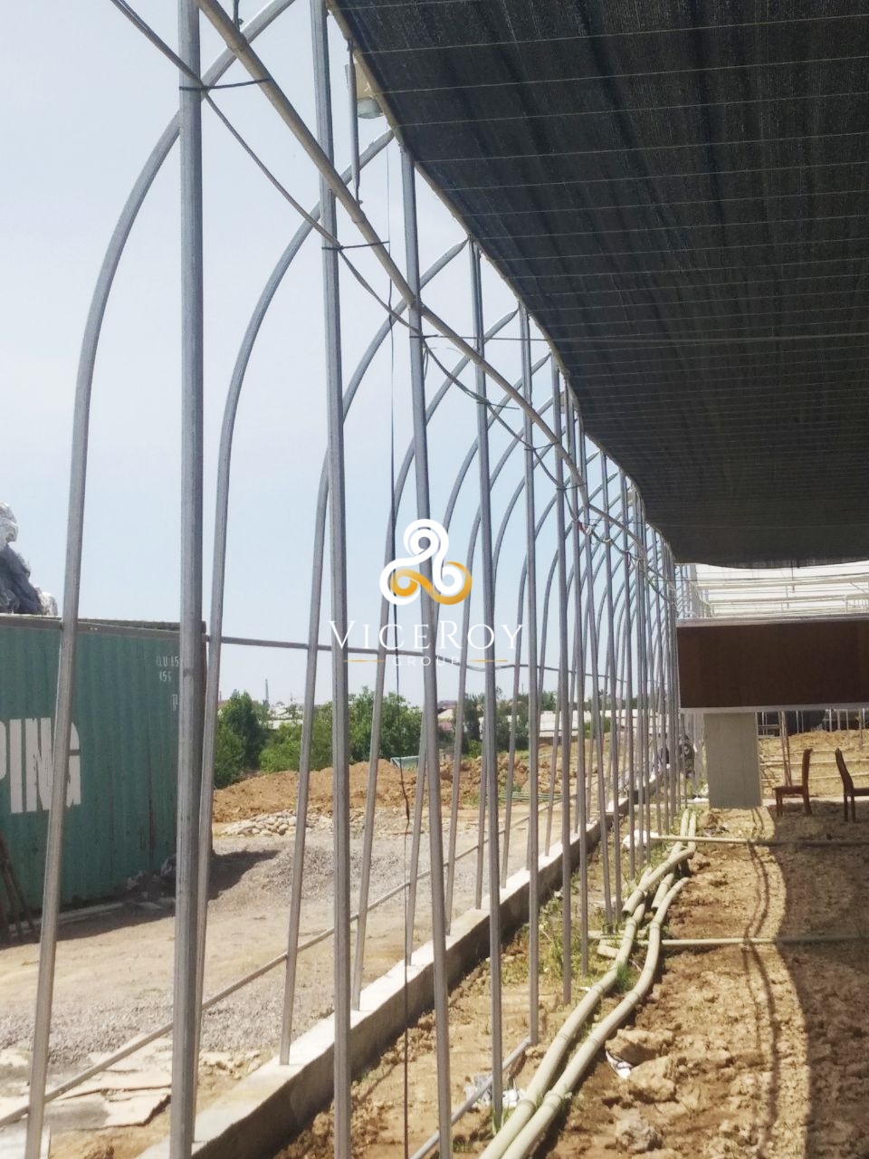 Interior structural framework of the greenhouse with an overhead screening system